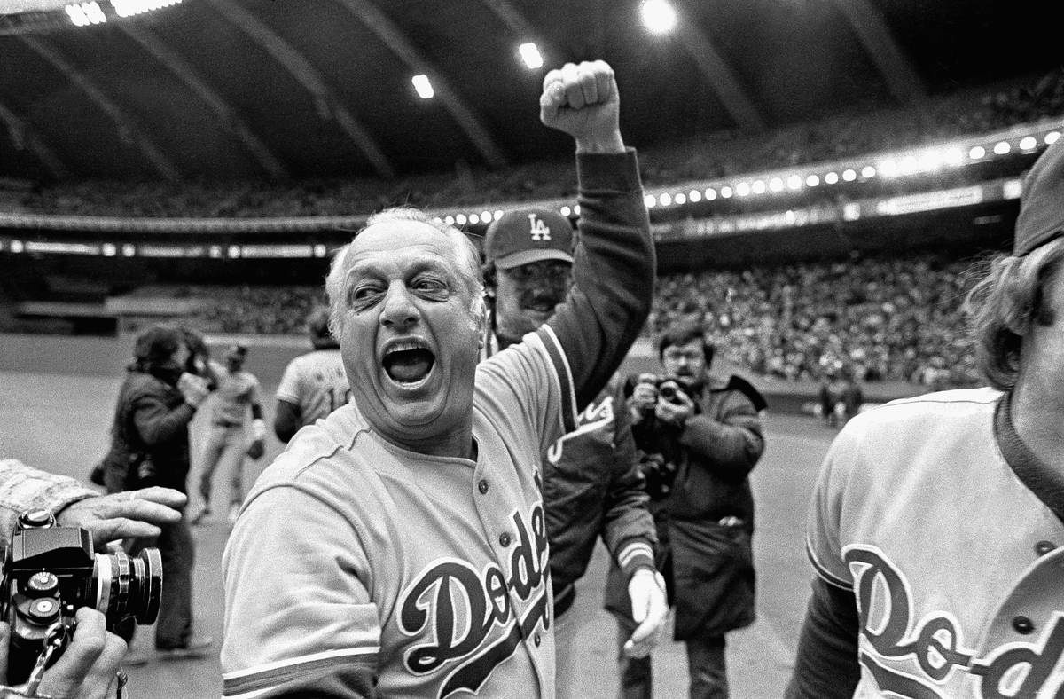 FILE - Los Angeles Dodgers manager Tom Lasorda celebrates after the Dodgers beat the Montreal E ...