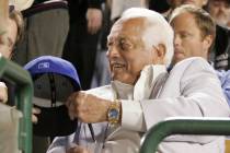 Former Los Angels Dodger coach Tommy Lasorda signs autograph as the Seattle Mariners take on th ...