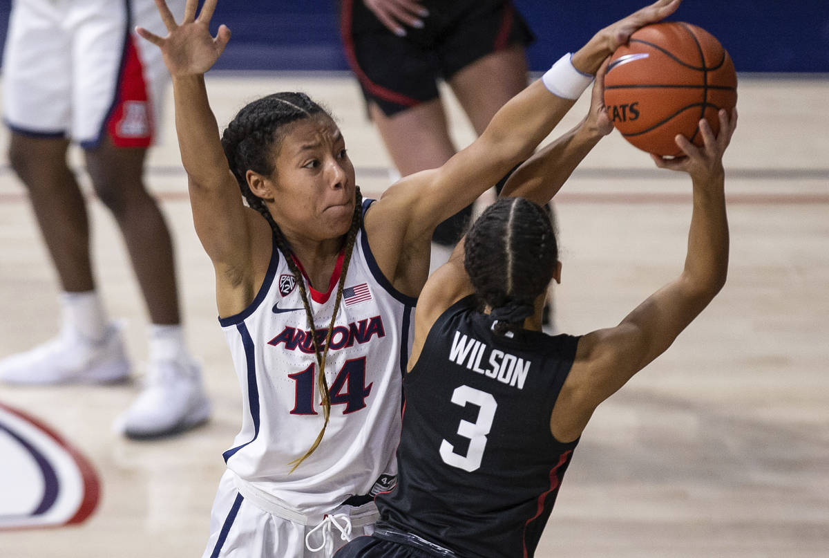 Arizona forward Sam Thomas (14) defends against Stanford guard Anna Wilson (3) during an NCAA c ...