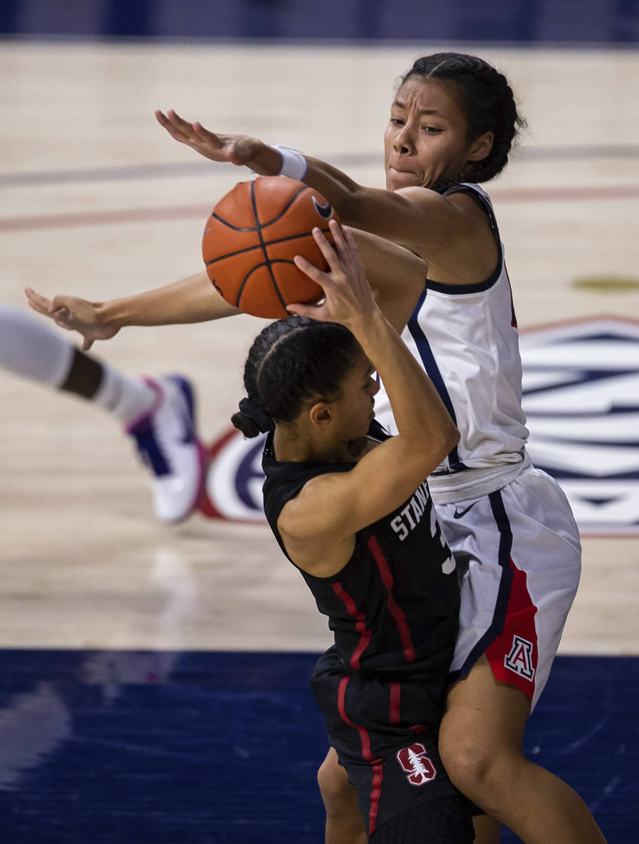 Arizona forward Sam Thomas (14) blocks Stanford guard Anna Wilson (3) during an NCAA college ba ...