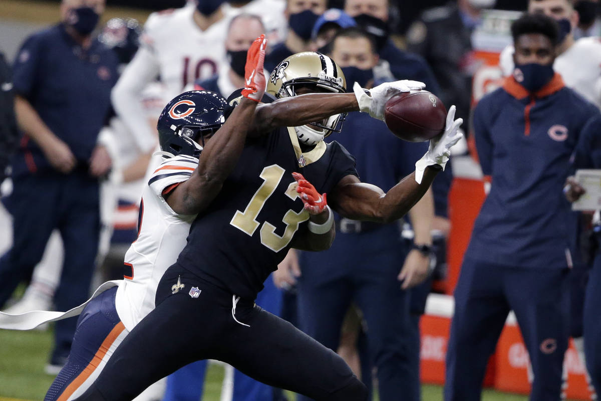 New Orleans Saints wide receiver Michael Thomas (13) pulls in a pass against Chicago Bears corn ...