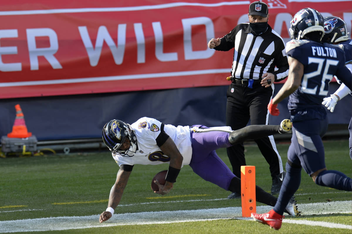 Baltimore Ravens quarterback Lamar Jackson (8) scores a touchdown on a 48-yard run against the ...