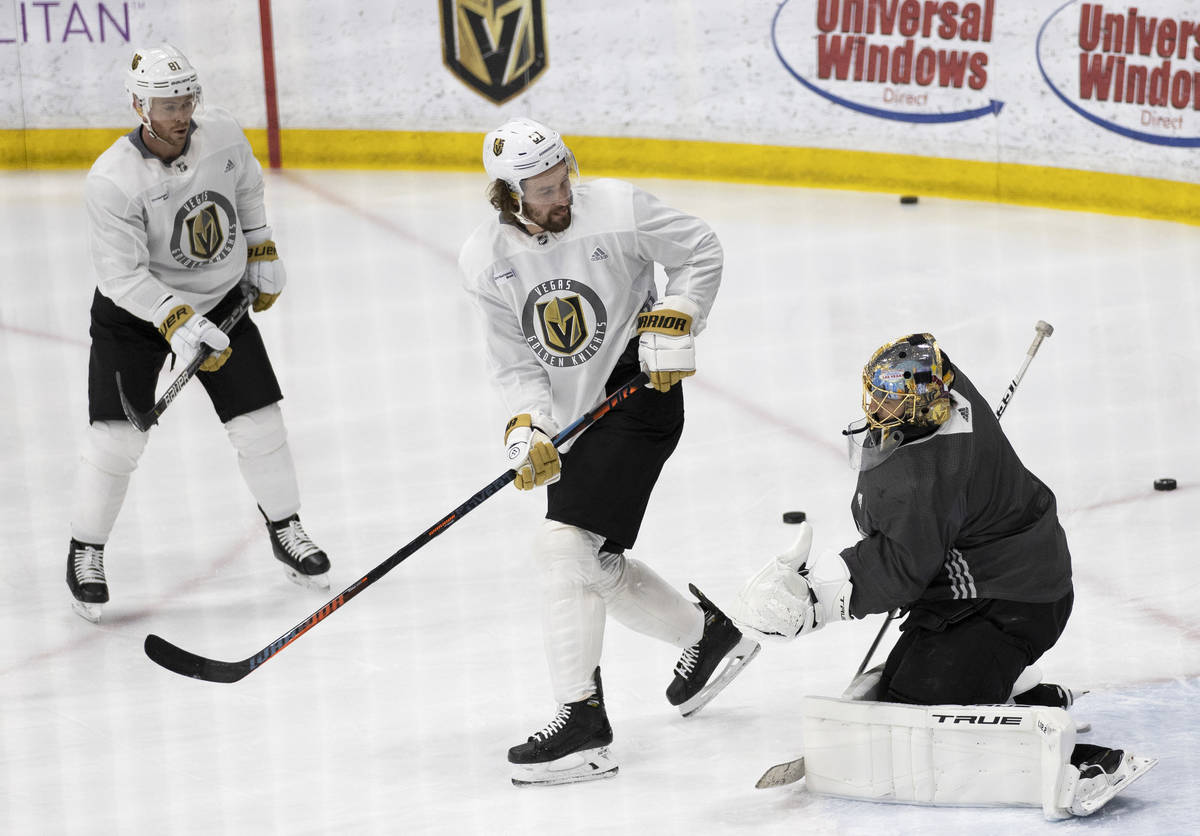 Golden Knights forward Mark Stone (61) redirects a shot at Golden Knights goaltender Marc-Andre ...