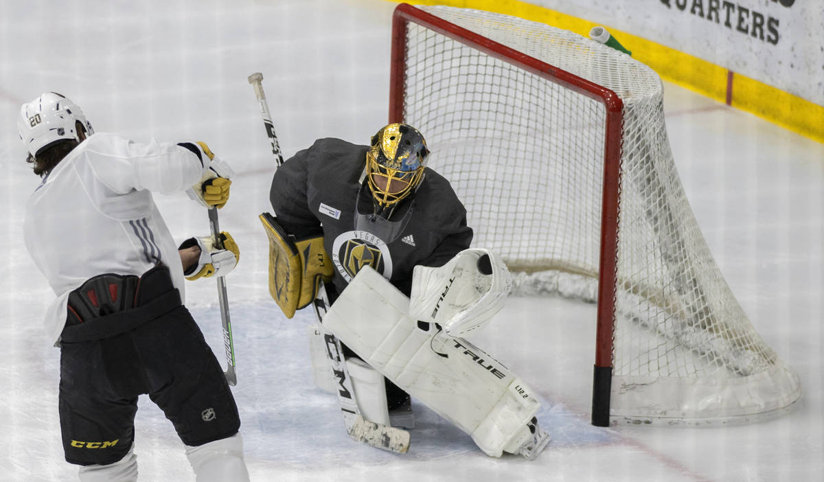 Golden Knights goaltender Marc-Andre Fleury (29) makes a save against Golden Knights forward Ch ...