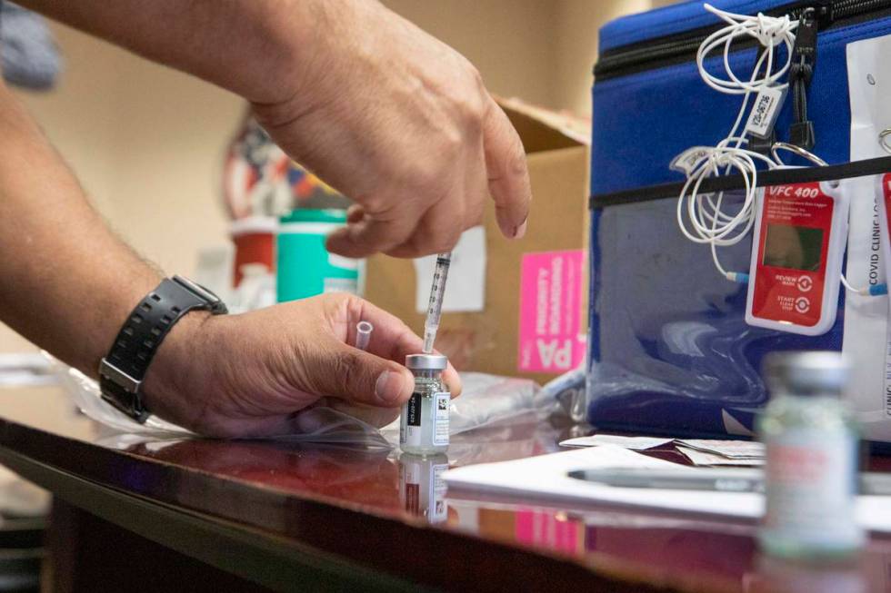 The North Las Vegas Fire Department administrates itÕs first batch of a COVID-19 vaccines ...