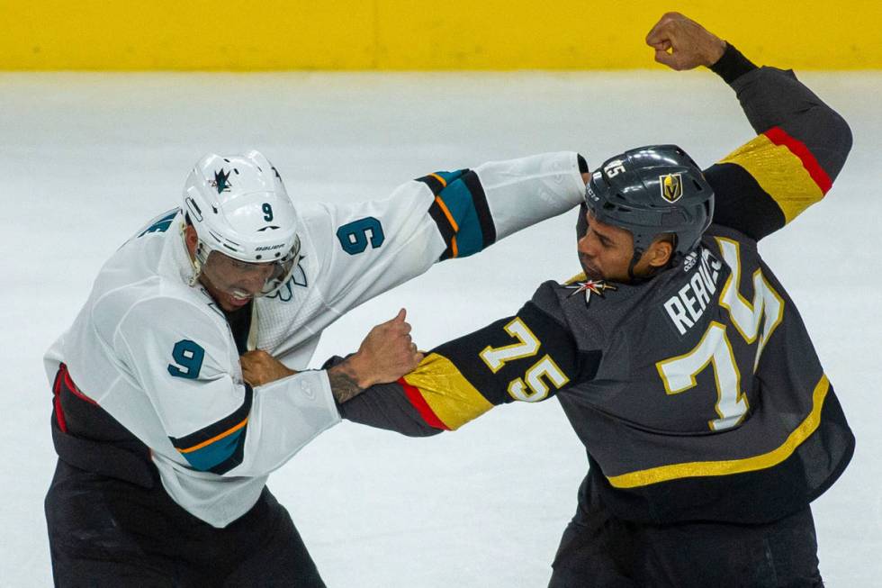 San Jose Sharks left wing Evander Kane (9) fights with Golden Knights right wing Ryan Reaves (7 ...