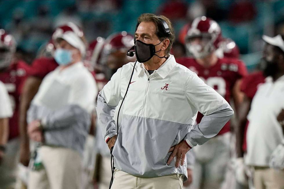 Alabama head coach Nick Saban watches his team during the first half of an NCAA College Footbal ...