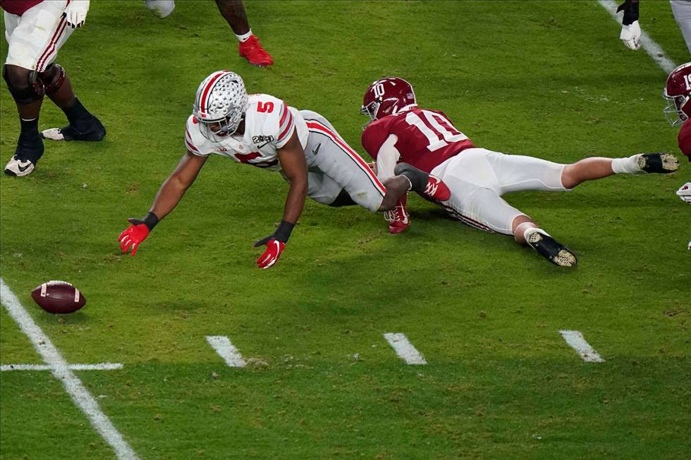 Ohio State linebacker Baron Browning recovers a fumble by Alabama quarterback Mac Jones during ...