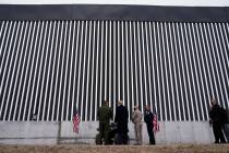 President Donald Trump tours a section of the U.S.-Mexico border wall under construction Tuesda ...