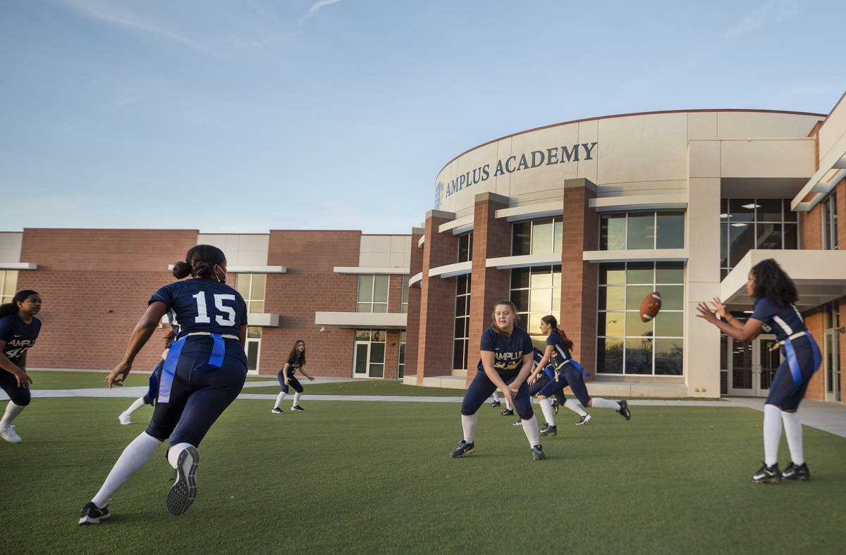 Amplus High SchoolÕs flag football team, which is one of the two schools playing in the fi ...