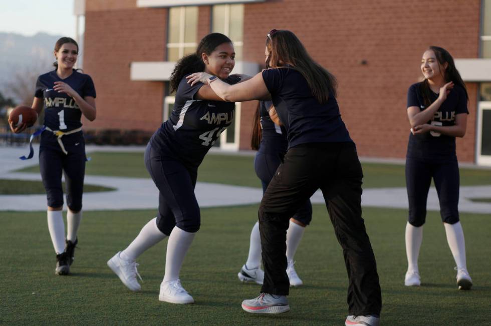 Amplus High SchoolÕs flag football team, which is one of the two schools playing in the fi ...