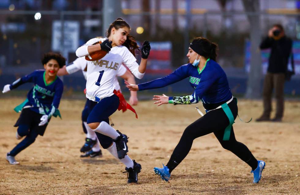 Amplus Academy's Karina Hudzenko (1) tries to avoid getting tagged by SLAM! Nevada's Oriana Isr ...