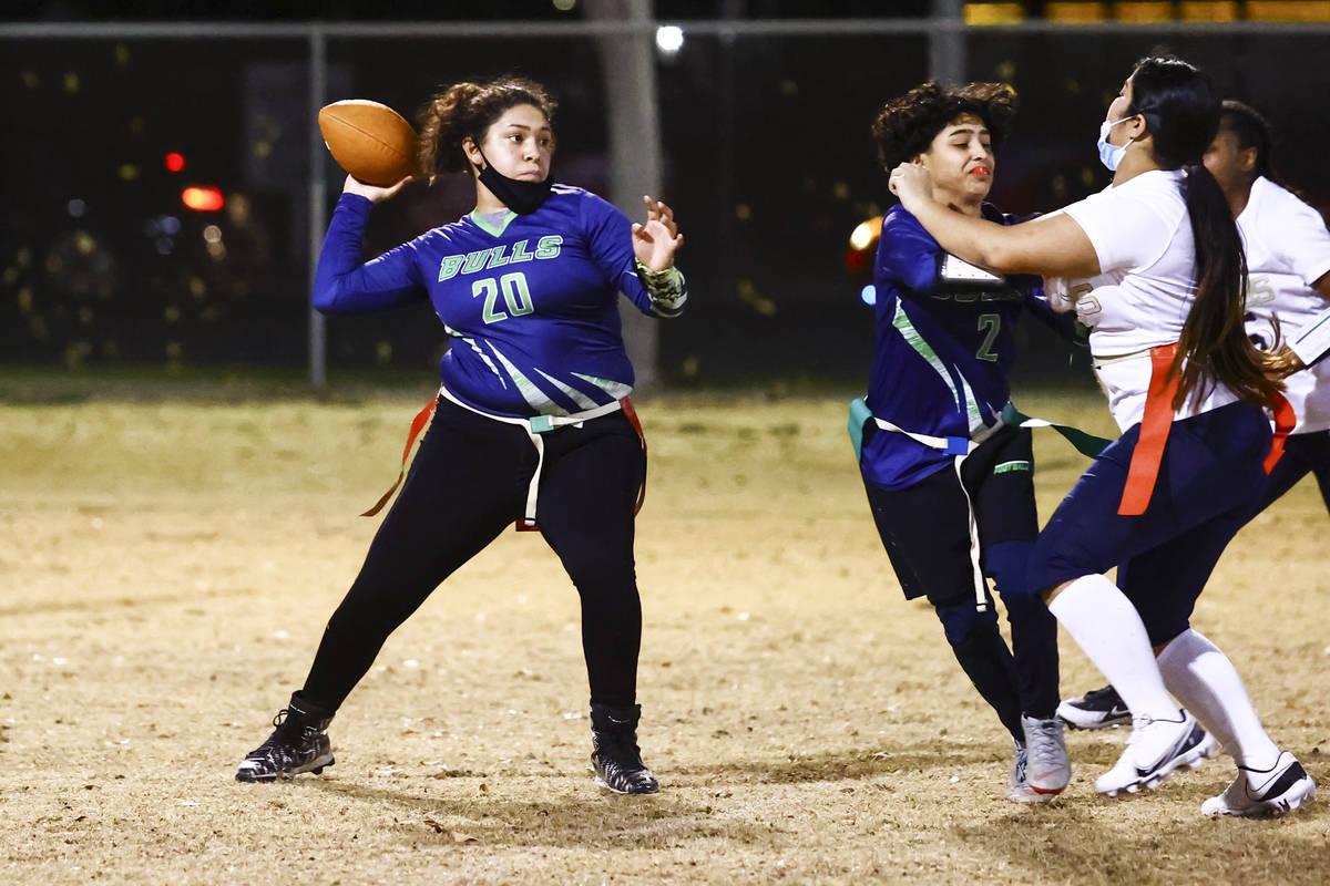 SLAM! Nevada's Lizette Valenciano looks to throw a pass during a flag football game against Amp ...