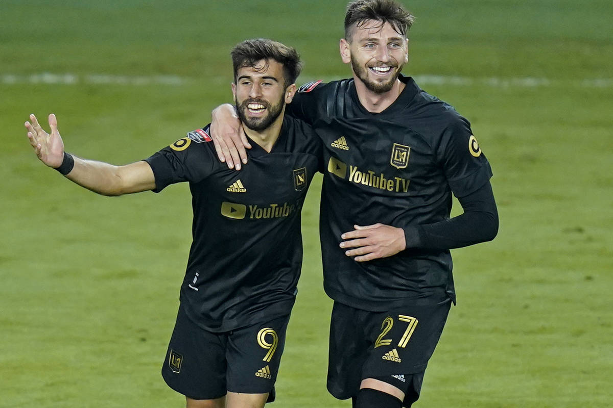Los Angeles FC forward Diego Rossi (9) celebrates his goal against Tigres with defender Tristan ...