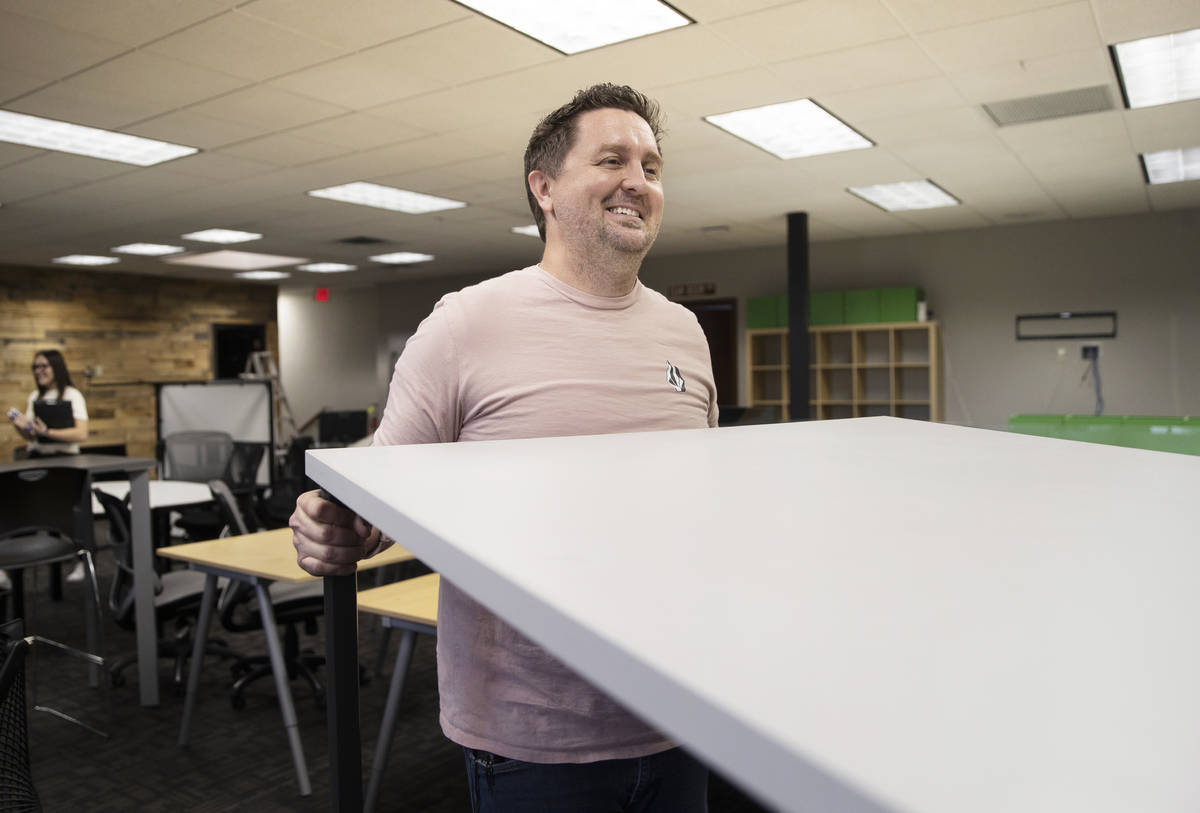 Kenny Eliason, co-owner of Work in Progress, lifts a table during the businesses last day on We ...