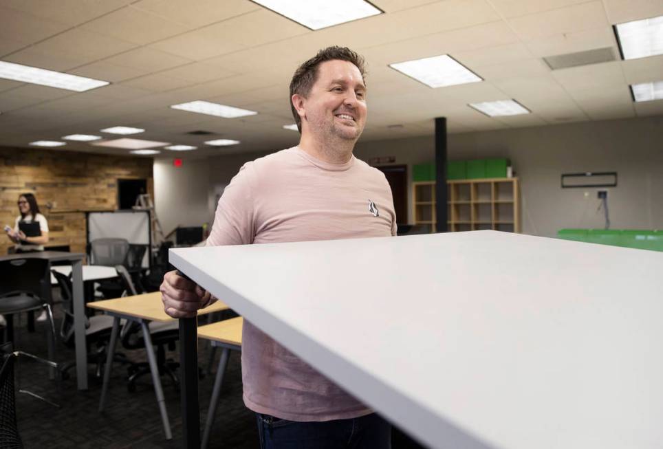 Kenny Eliason, co-owner of Work in Progress, lifts a table during the businesses last day on We ...