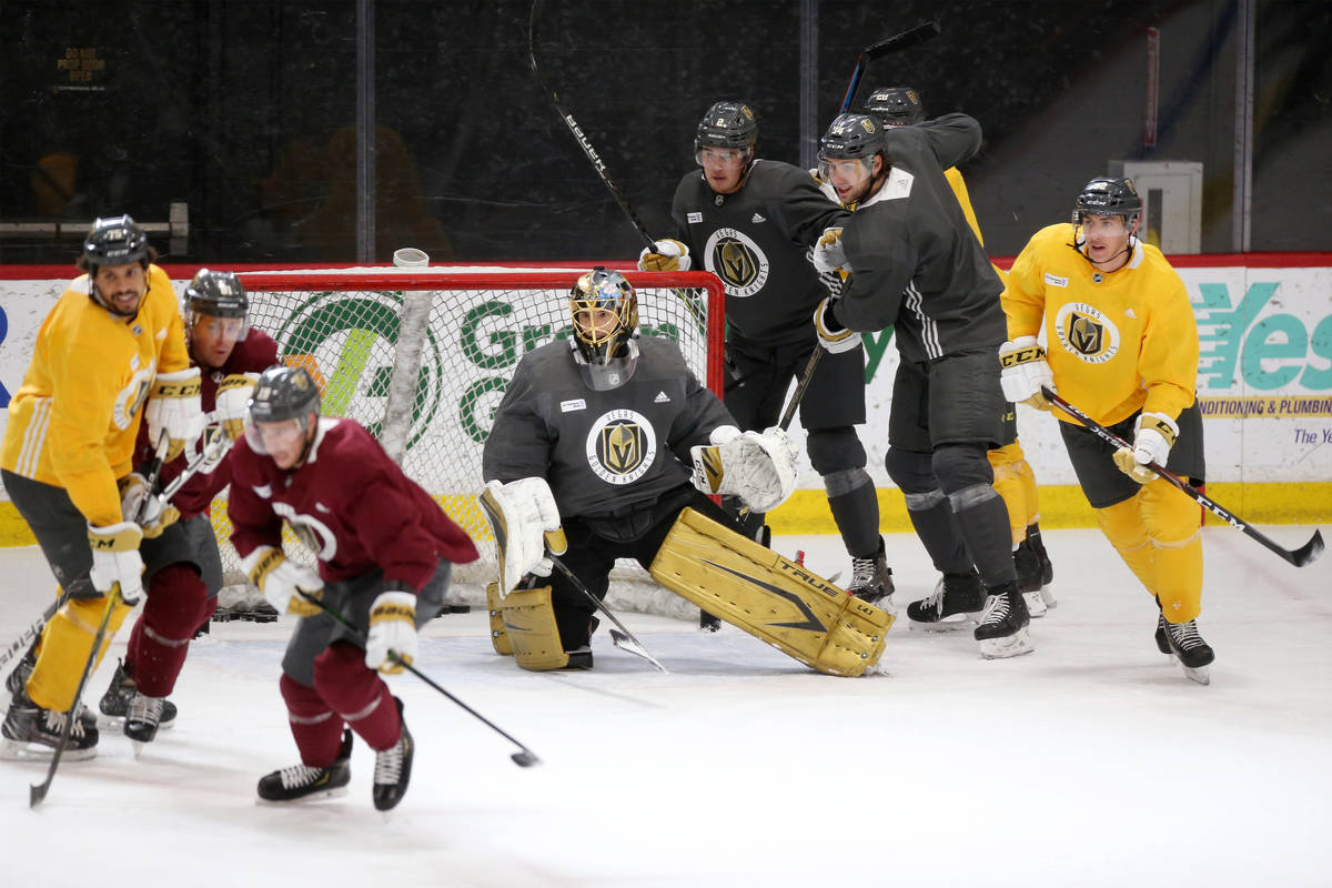 Vegas Golden Knights goaltender Marc-Andre Fleury, center, is seen with his teammates during a ...