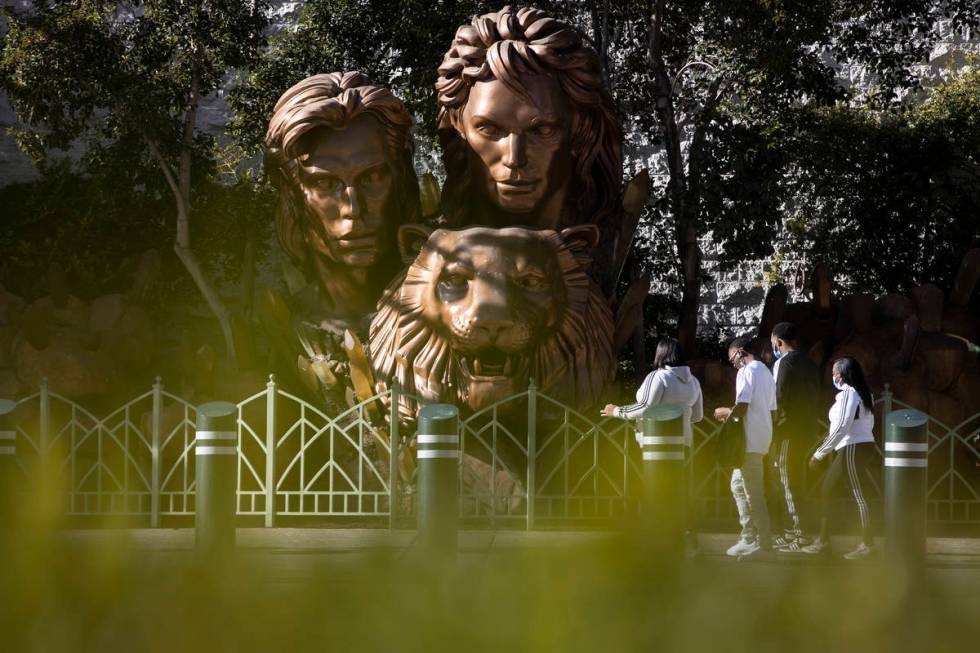 People walk in front of the Siegfried & Roy statue on the Strip in front of The Mirage hote ...