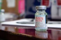 The North Las Vegas Fire Department administers its first batch of a COVID-19 vaccines to first ...