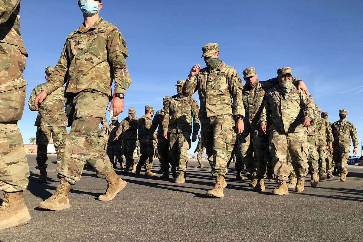 Members of the Nevada Army Guard prepare on Thursday, Jan. 14, 2021, to head to Washington, D.C ...