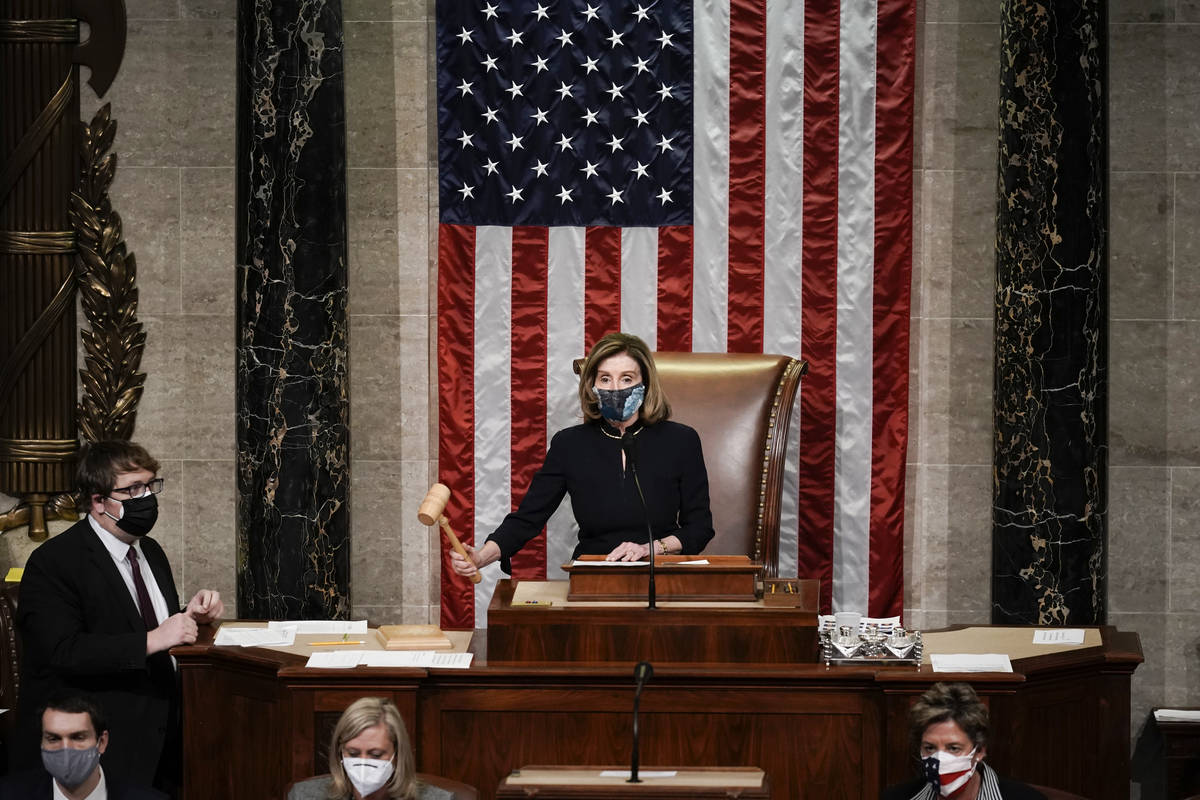 Speaker of the House Nancy Pelosi, D-Calif., gavels in the final vote of the impeachment of Pre ...