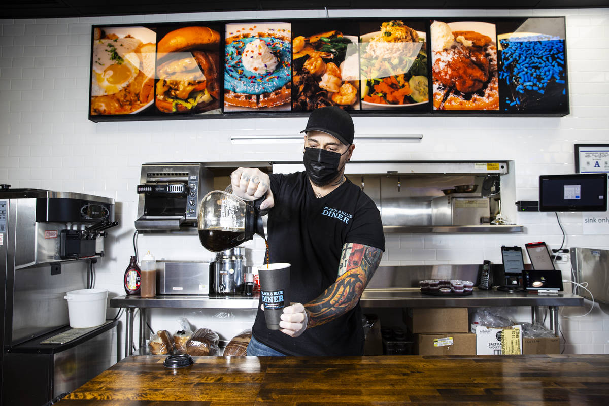 Chef Vic Vegas pours a cup of coffee at his new restaurant, the Black & Blue Diner, which opens ...