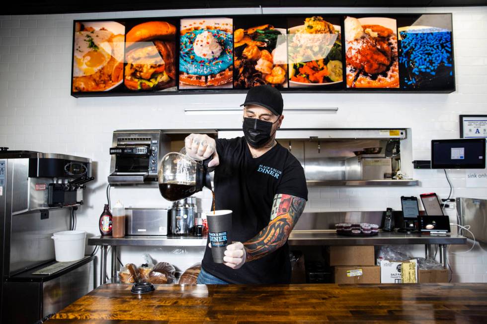 Chef Vic Vegas pours a cup of coffee at his new restaurant, the Black & Blue Diner, which opens ...