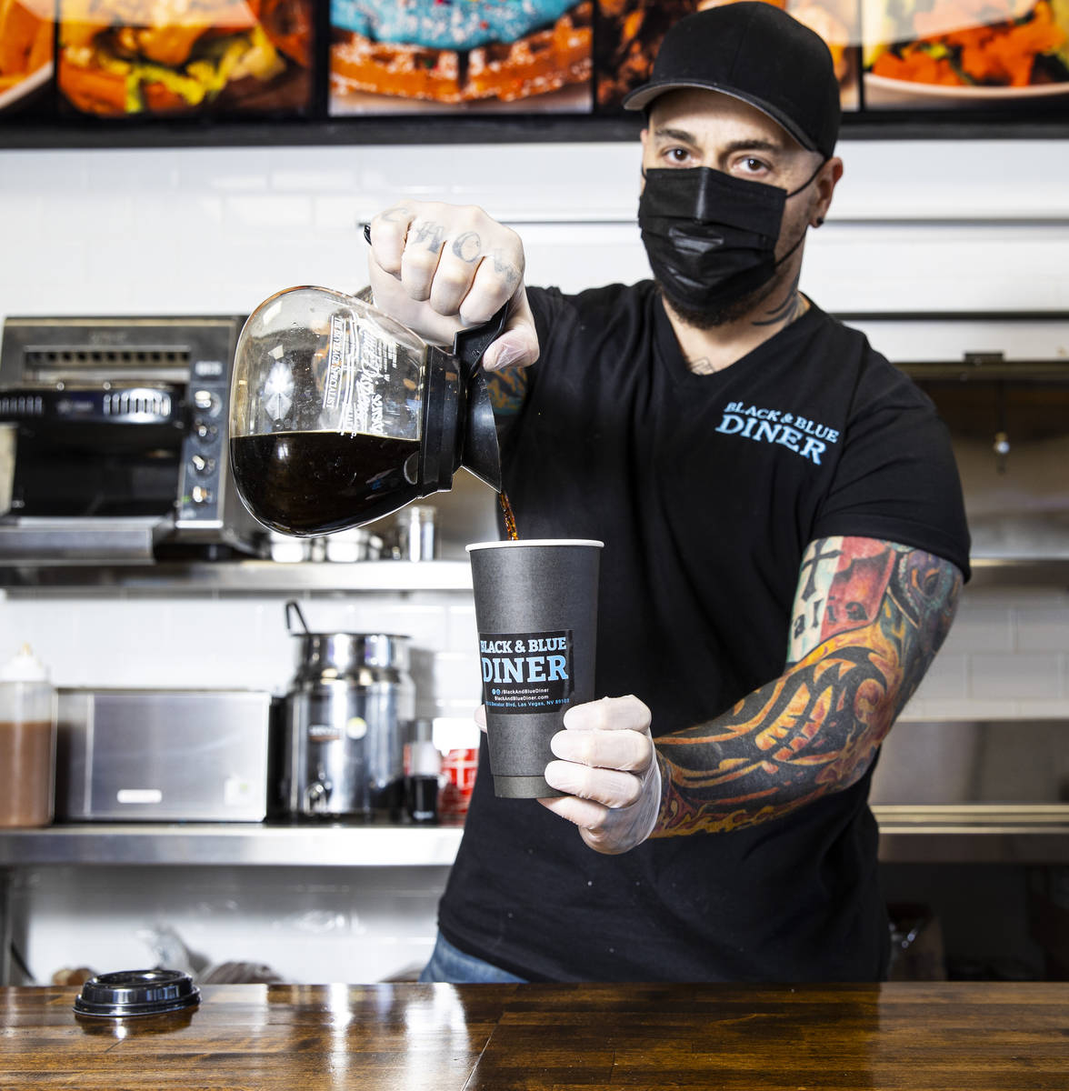 Chef Vic Vegas pours a cup of coffee at his new Black & Blue Diner, which opens Monday at 315 S ...