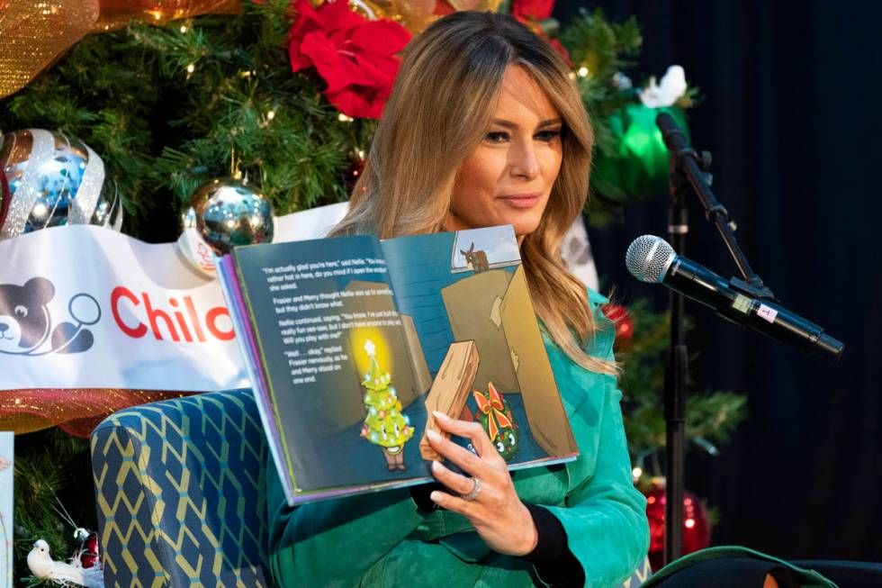 First lady Melania Trump reads a Christmas book to children who are patients at Children's Nati ...