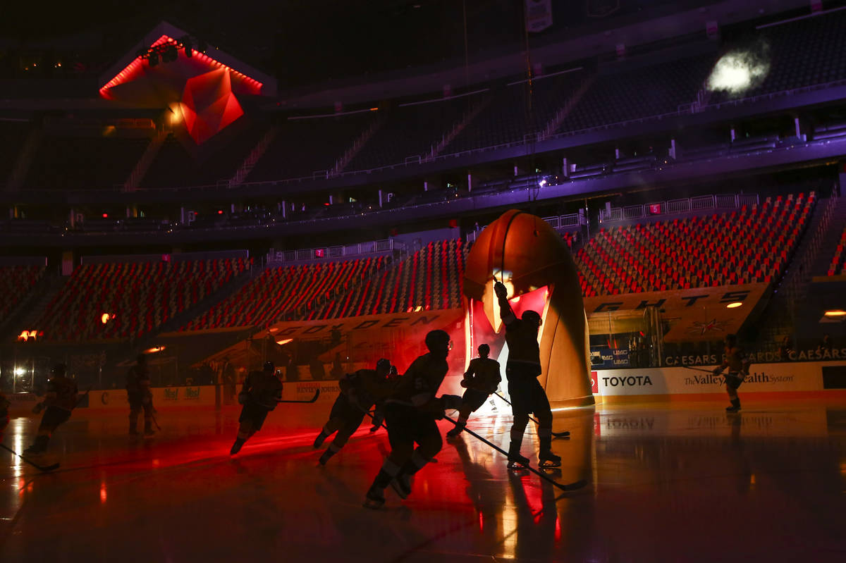 Golden Knights players skate onto the ice before taking on the Anaheim Ducks in an NHL hockey g ...