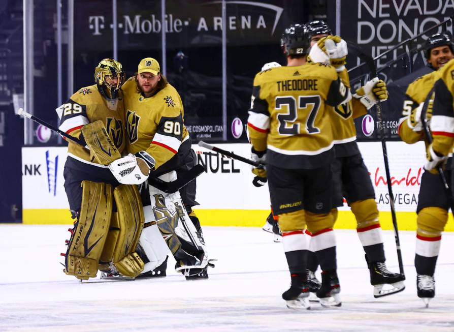 Golden Knights goaltenders Marc-Andre Fleury (29) and Robin Lehner (90) celebrate after their o ...