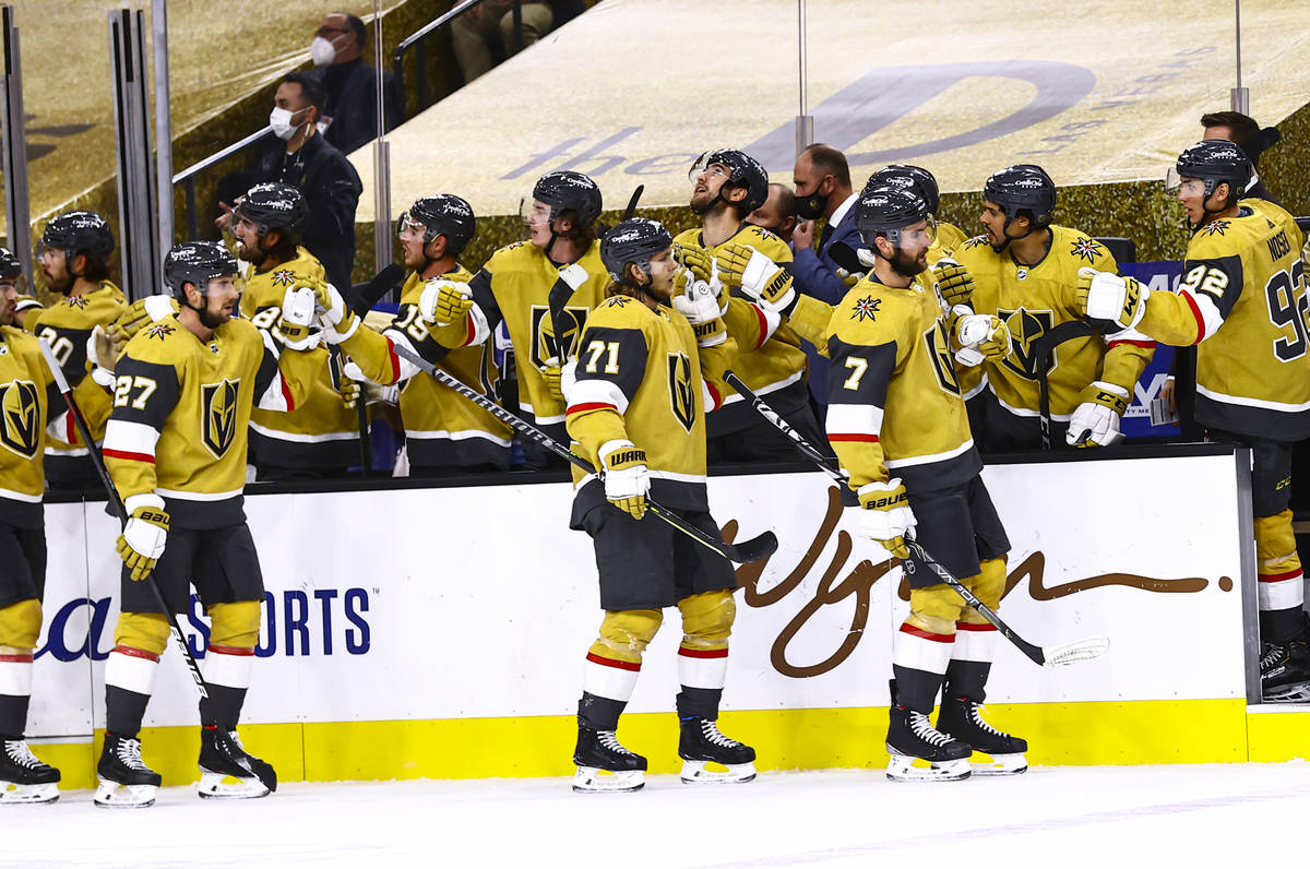 The Golden Knights celebrate a goal by center William Karlsson (71) during the third period of ...