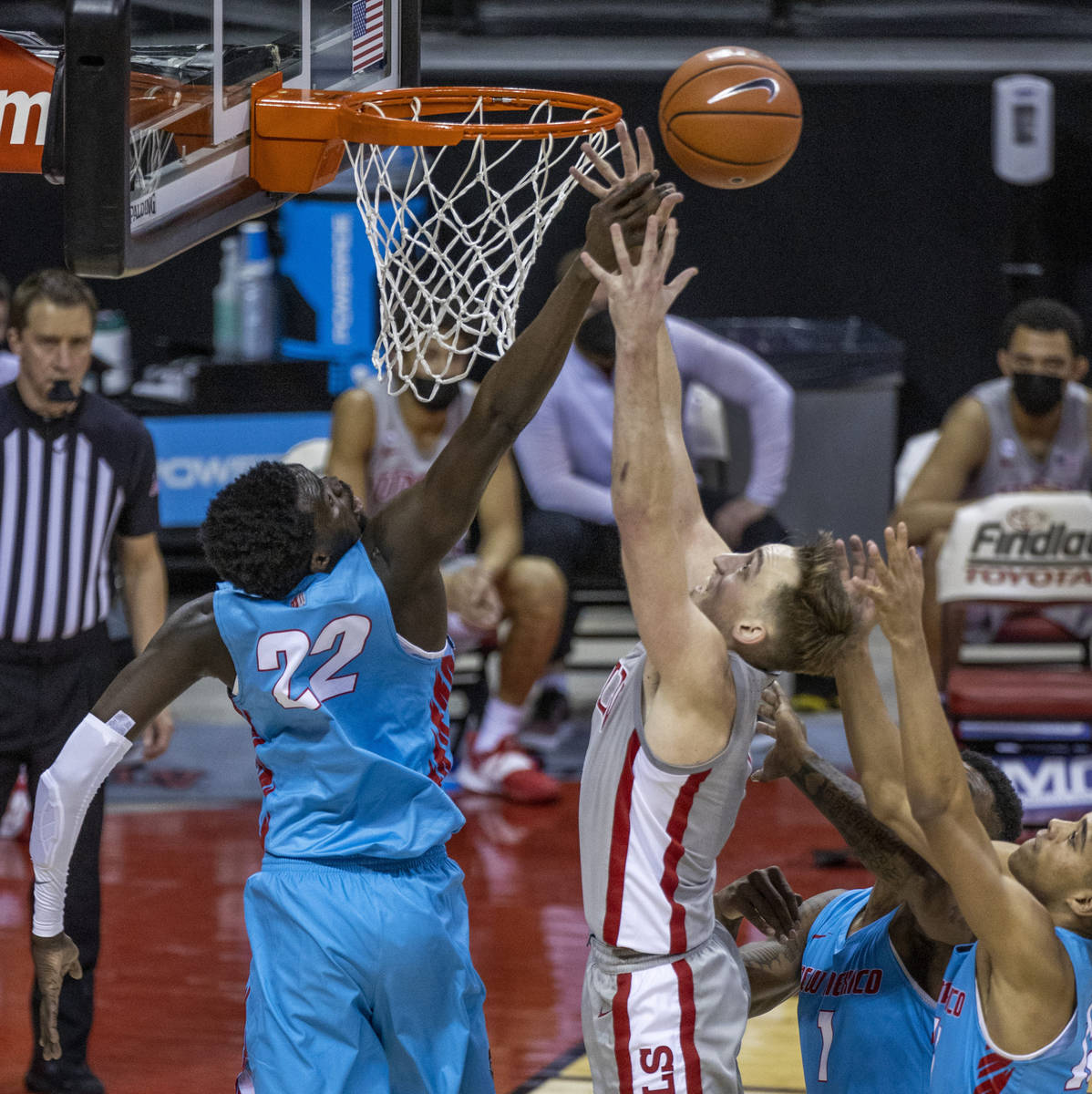 New Mexico Lobos forward Valdir Manuel (22) fouls UNLV Rebels forward Moses Wood (1) as he gets ...