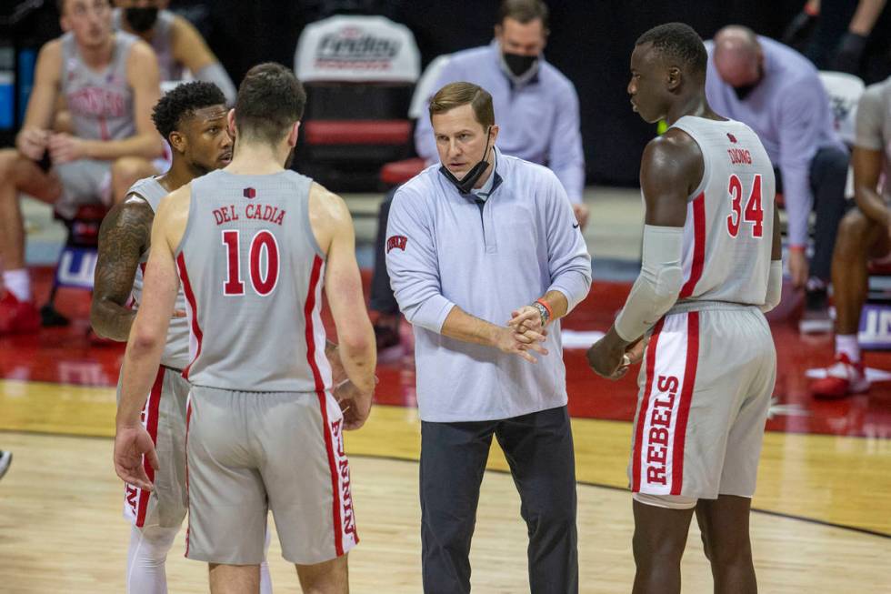 UNLV Rebels head coach T.J. Otzelberger coaches guard Bryce Hamilton (13), forward Edoardo Del ...