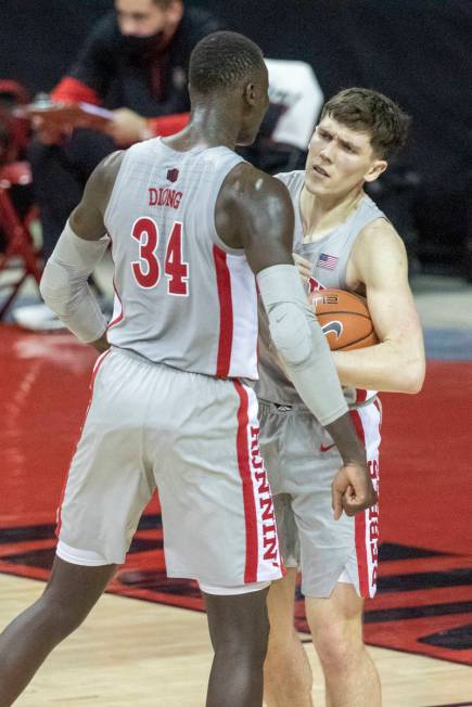 UNLV Rebels forward Moses Wood (1) is congratulated by forward Mbacke Diong (34) for drawing a ...