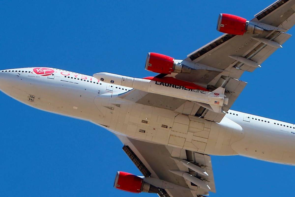 Virgin Orbit Boeing 747-400 rocket launch platform, named Cosmic Girl, takes off from Mojave Ai ...