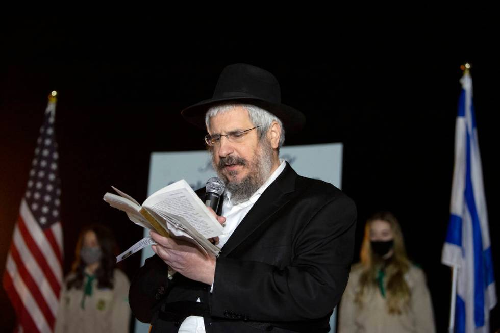 Rabbi Shea Harlig of Chabad of Southern Nevada reads Psalms during a tribute to the late Sheldo ...