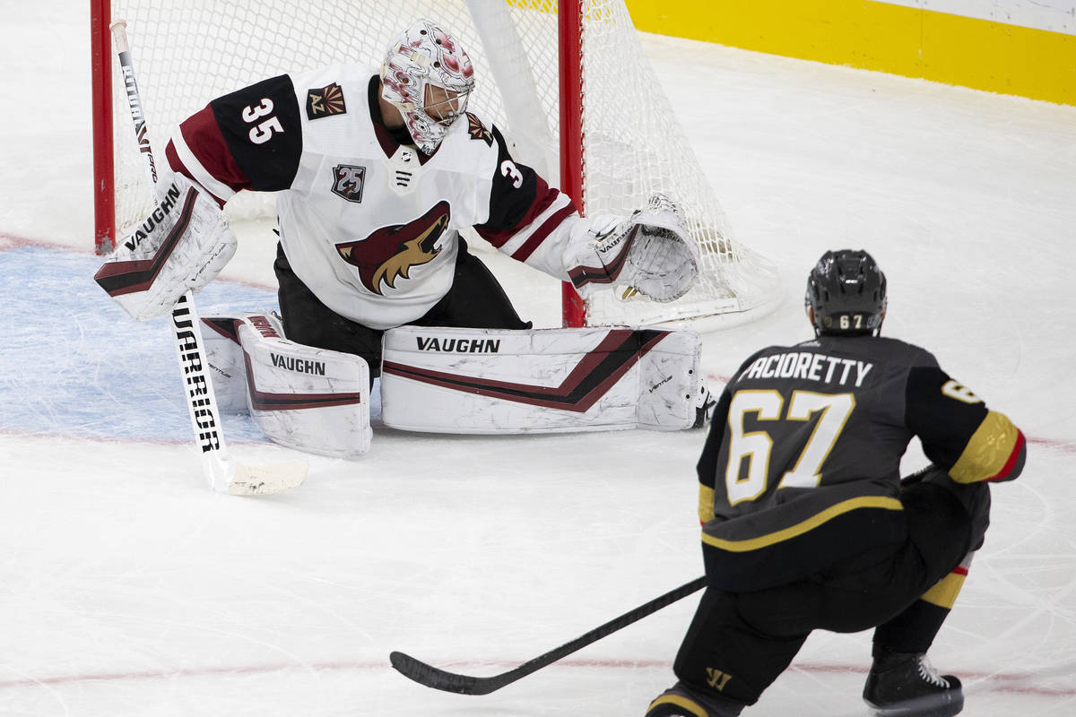 Golden Knights' left wing Max Pacioretty (67) shoots a goal as Arizona Coyotes' goaltender Darc ...