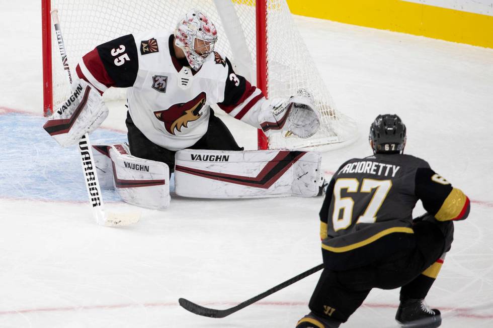 Golden Knights' left wing Max Pacioretty (67) shoots a goal as Arizona Coyotes' goaltender Darc ...