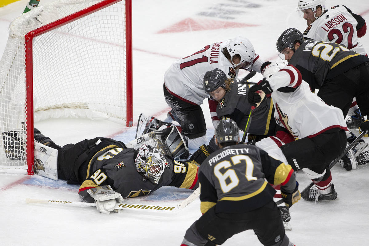 Golden Knights' goaltender Robin Lehner (90) saves a shot on goal from the Arizona Coyotes duri ...