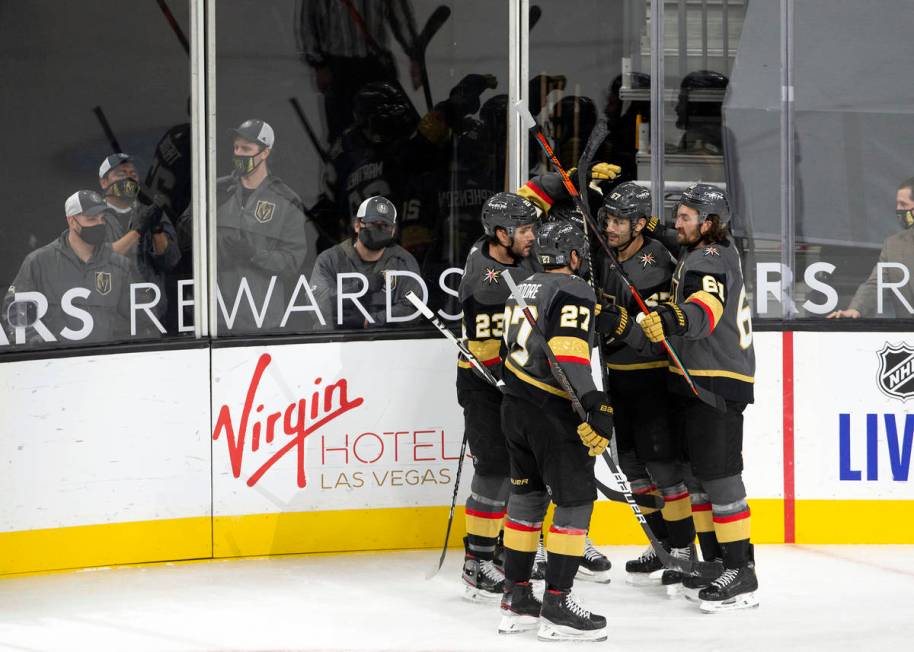 Golden Knights' members celebrate after left wing Max Pacioretty (67) scored a goal against the ...