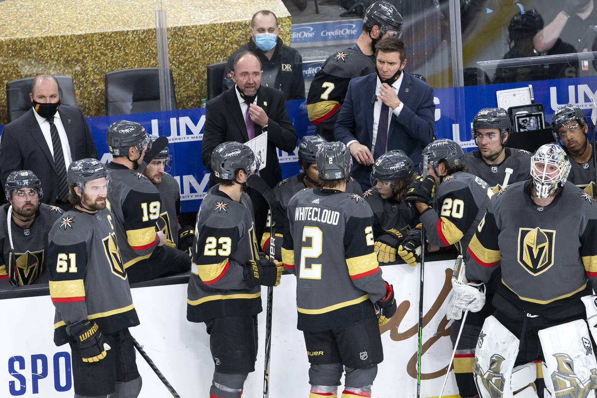 Golden Knights' head coach Peter DeBoer speaks to the team during the third quarter of their NH ...
