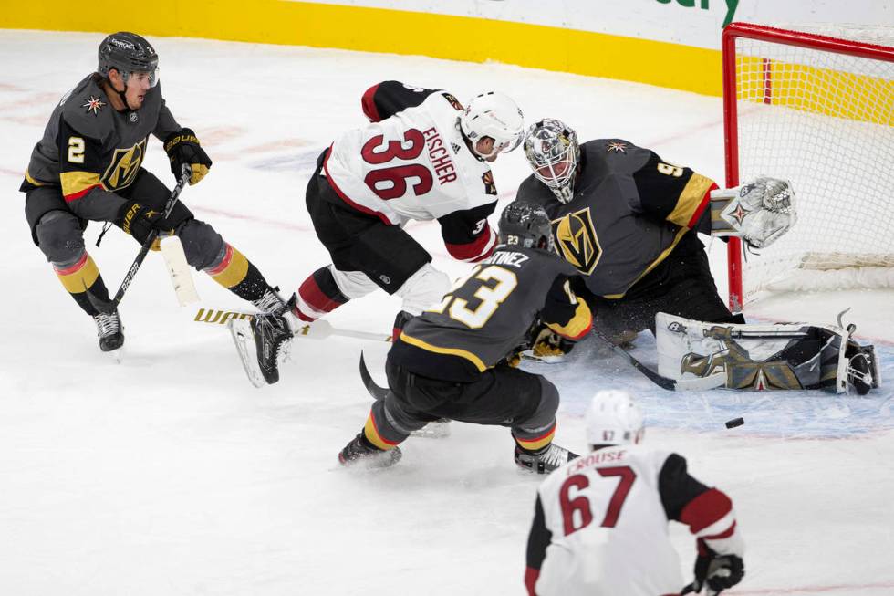 Golden Knights' goaltener Robin Lehner (90) saves a shot on goal from Arizona Coyotes' right wi ...