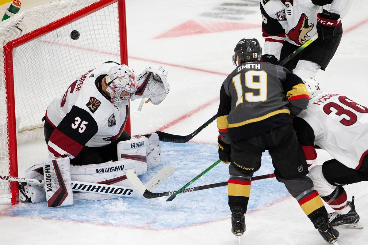 Golden Knights' right wing Reilly Smith (19) scores a goal as Arizona Coyotes' goaltender Darcy ...