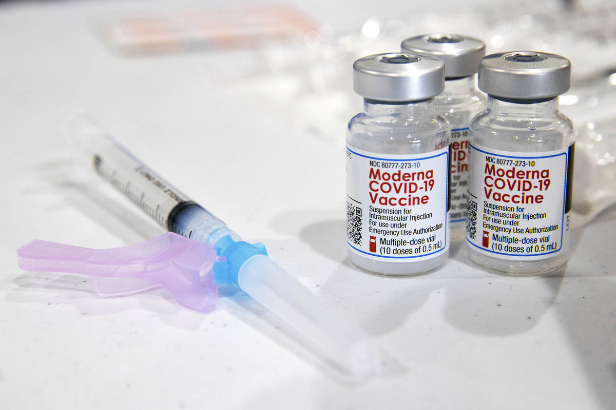 FILE - In this Jan. 9, 2021, file photo, vials of the Moderna COVID-19 vaccine are placed next ...