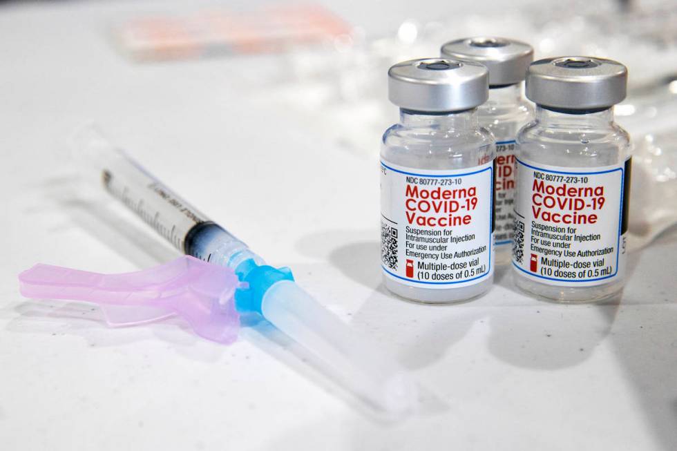 FILE - In this Jan. 9, 2021, file photo, vials of the Moderna COVID-19 vaccine are placed next ...
