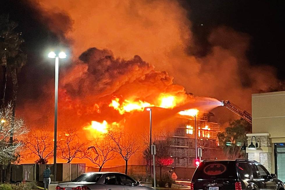 Fire crews battle a large fire in southwest Las Vegas early Tuesday, Jan. 19, 2021. (Dominic Gi ...