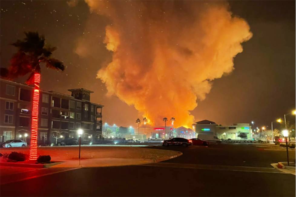 Fire crews battle a large fire in southwest Las Vegas early Tuesday, Jan. 19, 2021. (Dominic Gi ...