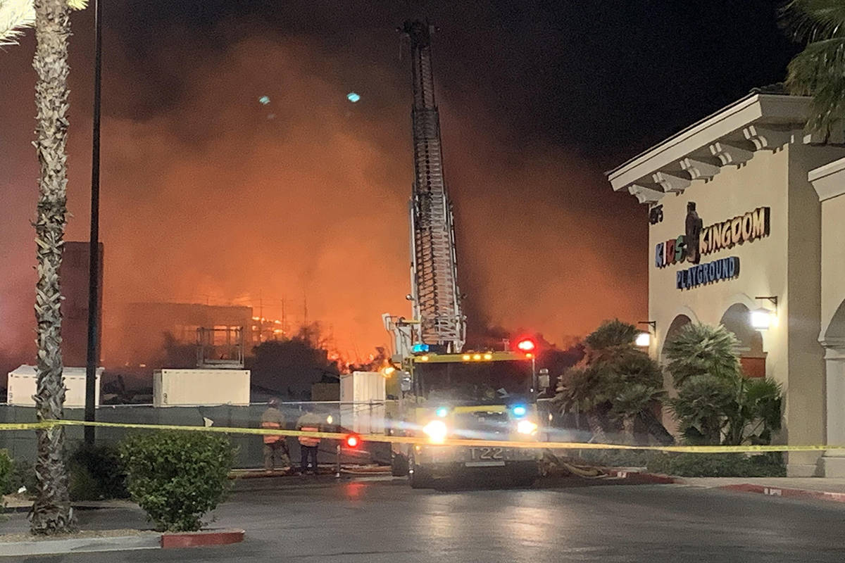 Fire crews battle a large fire in southwest Las Vegas early Tuesday, Jan. 19, 2021. (Alexis For ...