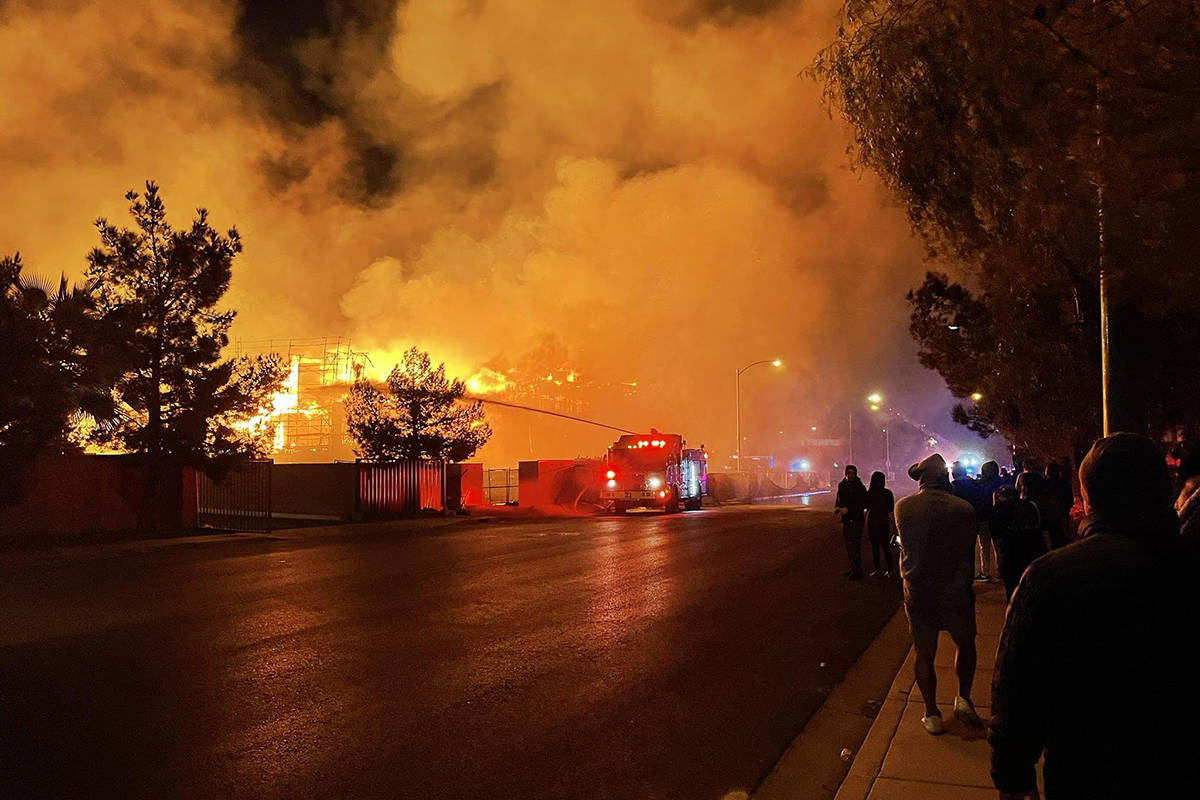 Fire crews battle a large fire in southwest Las Vegas early Tuesday, Jan. 19, 2021. (Dillon Nie ...